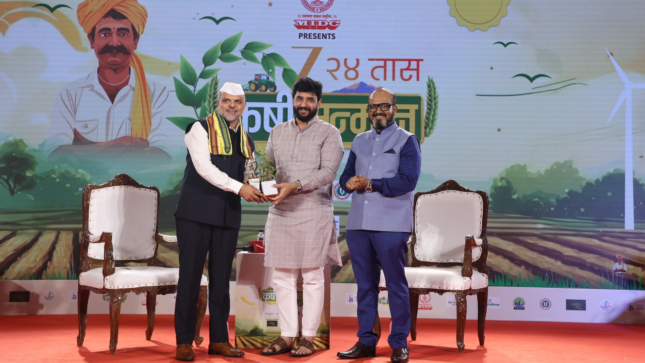Award presentation during the Zee 24 Taas Krushi Sanman 2025 ceremony, with dignitaries on stage honouring contributors to agricultural development.