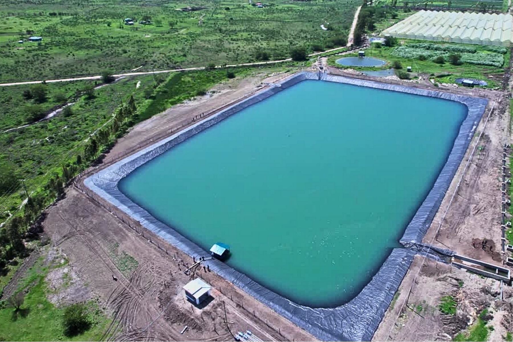 HDPE geomembrane-lined farm pond for water conservation and irrigation storage
