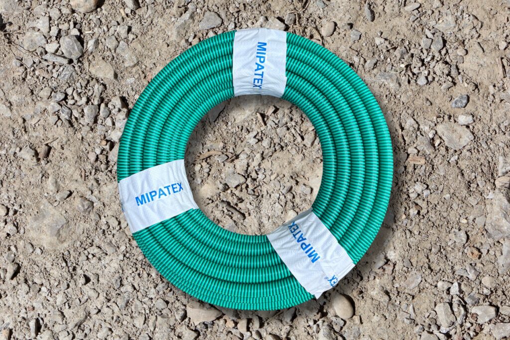 MIPATEX PVC suction hose used for water pumping, irrigation, and industrial discharge.