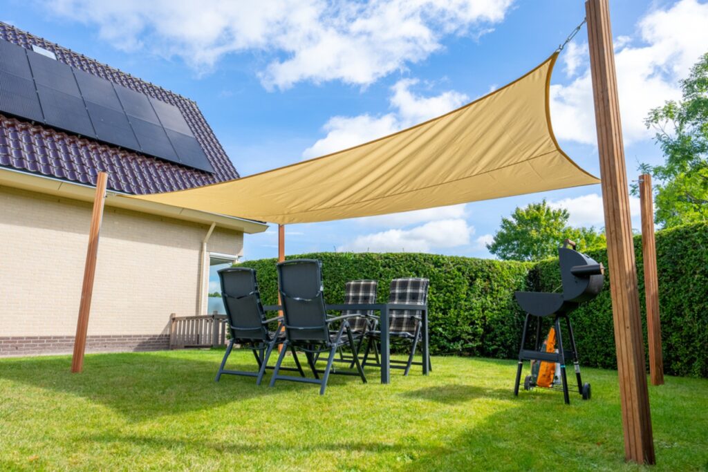 Outdoor shade sail made from MIPATEX HDPE shade net providing sun protection for garden and patio areas.