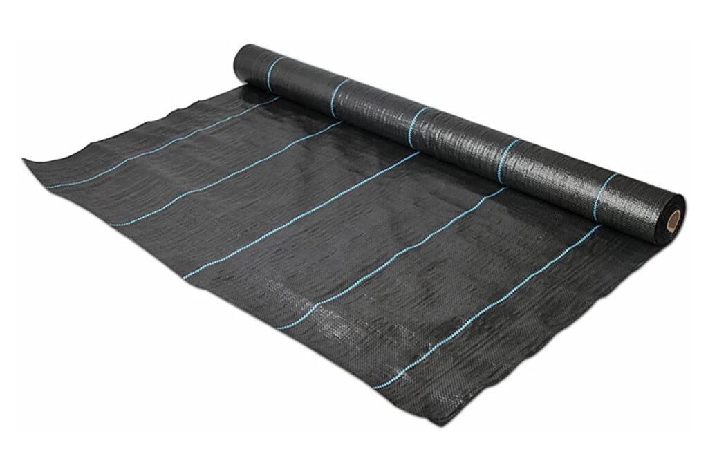 Black woven weed control mat roll with blue marking lines for soil and crop protection.